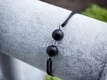 Védelmező angyal ónix microcord karkötő