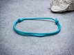 Kép 1/2 - Hűség türkiz paracord karkötő
